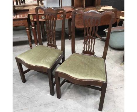 A pair of 19th century Chippendale style dining chairs, drop in upholstered seats on square supports (2)