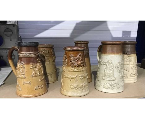 A collection of Stoneware saltglazed mugs, in the style of the Mortlake and Vauxhall factories, cylindrical tapered form, wit