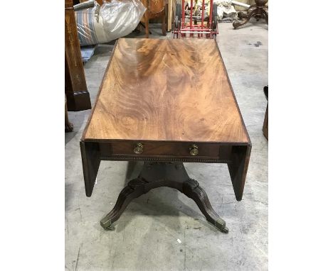 A Regency mahogany sofa table, circa 1820, two frieze drawers, square support, quatrefoil plinth raised on acanthus carved sa