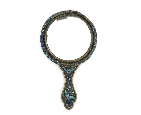 A Chinese silver plated copper and enamelled hand mirror, decorated in relief with prunus tree and moths, 28cm long