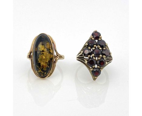 A 9ct gold garnet cluster ring and a 9ct gold amber ring, ring sizes: P/P 1/2 and M 1/2, 7.2g (2)