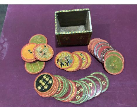 Ganjifa Indian playing cards, a part set with box, early 20th century, circular form, painted on lacquered card with court fi