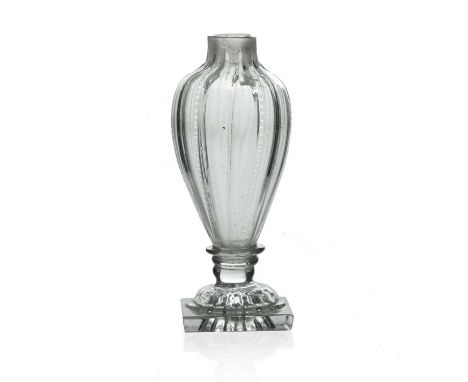 An Anglo-Irish glass cruet bottle, circa 1780, inverse baluster form, optic moulded vertical ridges on a moulded lemon squeez