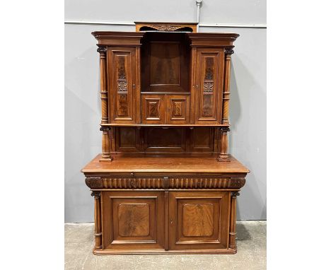 An Edwardian buffet, fitted open shelf above double doors, flanked by two single doors; the base fitted double doors revealin