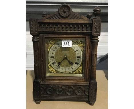 A German carved oak Aesthetic Movement mantel clock