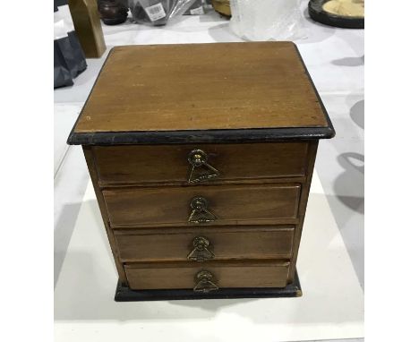 A mahogany set of four trinket drawers, 22cm high