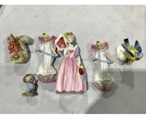 A Collection of ceramic figures, including A Royal Doulton figure, Miss Demure, HN1402, a Wade figure 'Nod', a Royal Doulton 