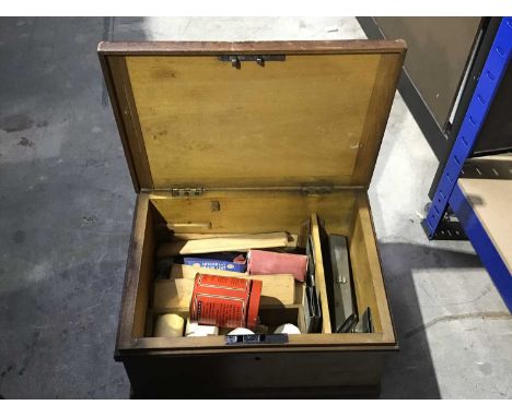 A vintage wooden first aid box, leather strap handle, some contents including bandages, wooden splints etc, (key). Note: proc