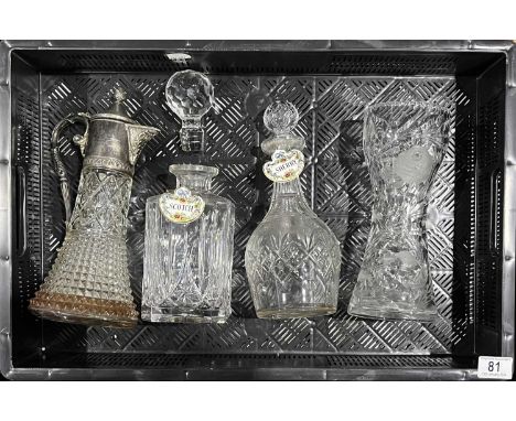 Two cut glass decanters and stoppers, with enamel scotch and sherry labels, together with a metal mounted claret jug and cut 