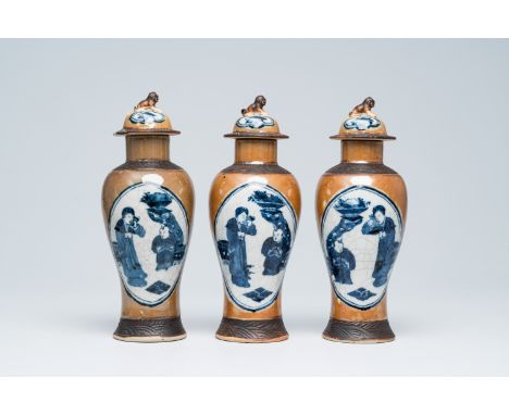 Full title: Three Chinese Nanking crackle glazed blue and white Batavian ware vases with figures, Kangxi mark, 19th C.Descrip