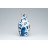 A Chinese blue and white vase with bamboo all around, Kangxi mark, 19th C.