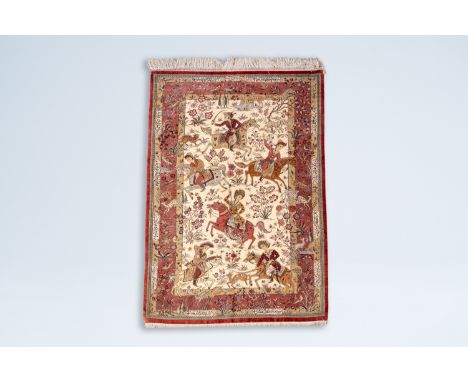 Full title: A Persian Nain rug with hunting scenes and calligraphic inscriptions, silk on cotton, marked, Iran, 20th C.Descri