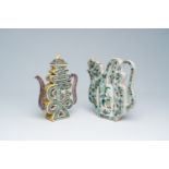Two Chinese verte biscuit 'puzzle' teapots and covers with figures in a landscape and floral design,