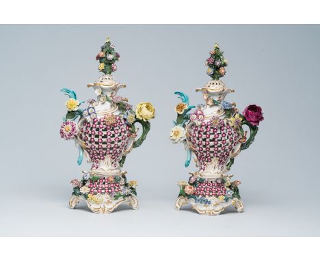 Full title: A pair of German open worked polychrome decorated porcelain flower encrusted vases and covers, Dresden mark, 20th