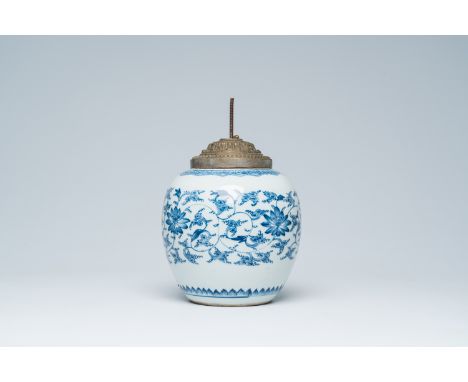 Full title: A Chinese blue and white jar with floral design mounted as a lamp, KangxiDescription:H 31,5 cm (incl. the mounts)