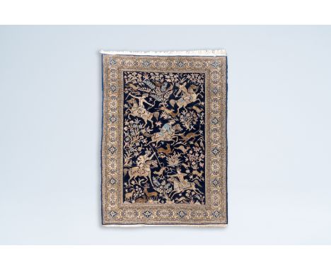 Full title: A Persian Nain rug with hunting scenes, wool on cotton, Iran, 20th C.Description:214 x 139 cm
