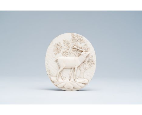 Full title: A German or Austrian basso relievo ivory plaque with a deer on a rock in a forest, late 19th C.Description:10,5 x