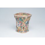 An octagonal Chinese Canton famille rose flower holder with palace scenes and flowers and squirrels
