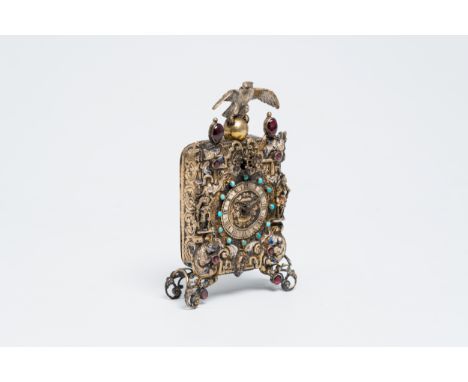 Title: A gilt silver Baroque revival Viennese table clock crowned with an eagle and inlaid with turquoise, late 19th C.Descri