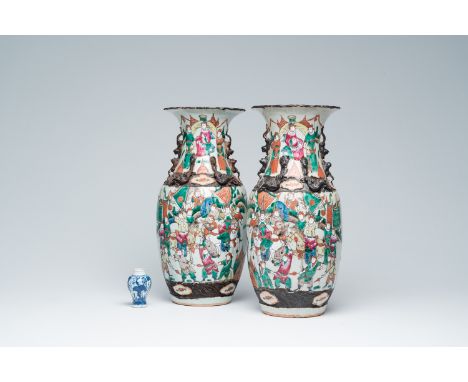 Full title: A pair of Chinese Nanking crackle glazed famille rose 'warrior' vases and a blue and white 'grape vines' vase, Ka