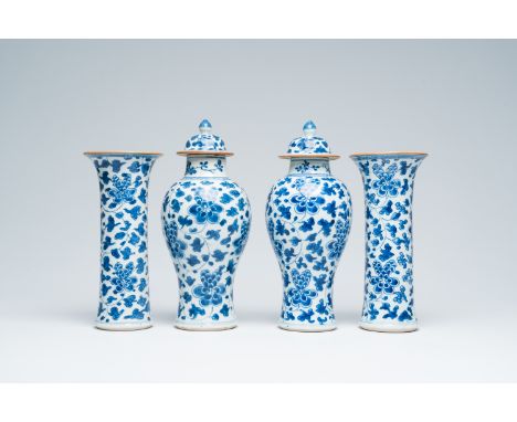 Full title: A Chinese blue and white four-piece vase garniture with floral design, KangxiDescription:H 30,4 cm (the two vases