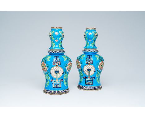 Full title: A pair of French polychrome Gien vases in the manner of Longwy with floral design, 19th C.Description:H 31,4 cm  