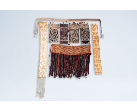 Full title: A varied collection of Oriental textile fragments including silver thread, 19th/20th C.Description:228 cm (the la