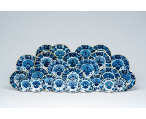 Full title: Twenty-five Dutch Delft blue and white 'peacock tail' plates and saucers, 18th C.Description:Dia.: 23,7 - 12,8 cm