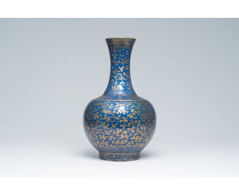 Title: A Chinese blue ground gilt decorated 'bats amongst scrolling clouds' bottle vase, Guangxu mark and of the periodDescri