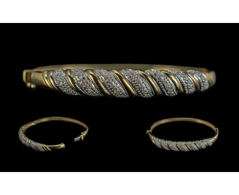 Ladies 9ct Gold Attractive Diamond Set Hinged Bangle. Full Hallmark to Interior of Bangle. Weight 10.1 grams. Diameter 2.5 In
