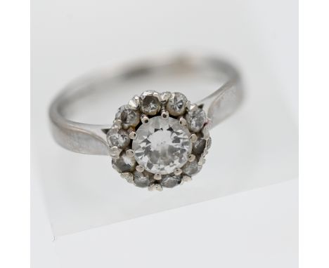 An 18ct white gold diamond cluster ring, size K.