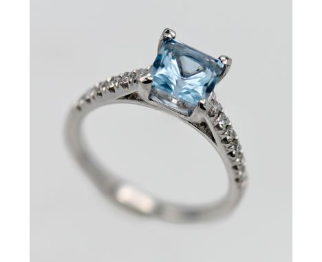 An 18ct white gold topaz and diamond ring, size N.