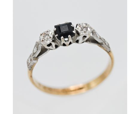 An 18ct and platinum sapphire and diamond set ring, size M.