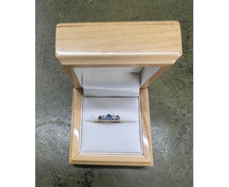 An 18ct yellow gold diamond and sapphire ring, size J.