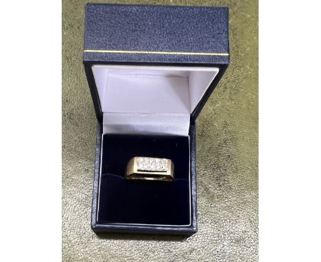 An 18ct yellow gents ring set with ten diamonds, size R/S, total weight 7.68g