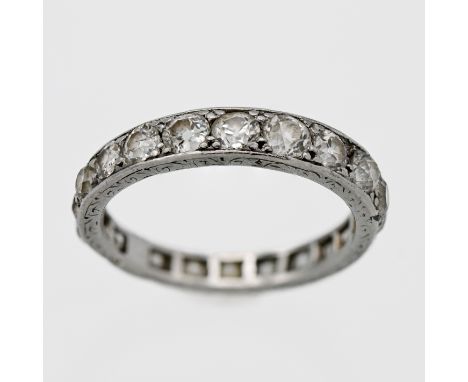 A platinum set diamond full eternity ring mixed of old brilliant cut diamonds in stud claw setting, size O