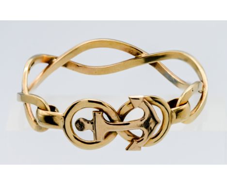 A 9ct yellow gold cuff bangle of twist rope design with centre anchor motive, approx 30g (not hallmarked).