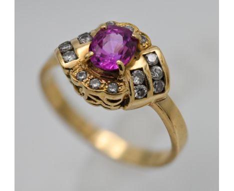 An 18ct stylish gem set ring, set with an array of diamonds, size O.