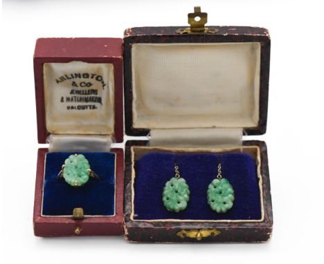 A 9ct ring set with a green jade stone, size N, together with a pair of matching earrings set in 9ct gold.
