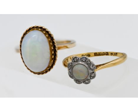 A 9ct yellow gold single cabochon cut opal ring, size M, together with an 18ct yellow gold diamond and opal cluster ring, siz