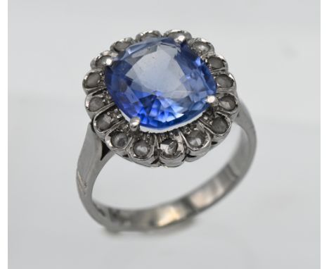 A fine sapphire and diamond cluster ring, cushion cut, sapphire assessed as Ceylon Pale blue estimated weight 6.66ct (11.9 x1