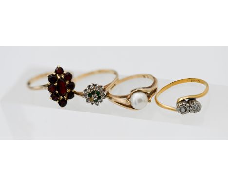 Three 9ct gold dress rings, approx 6.9g together with an 18ct yellow gold diamond twist ring, approx 1.9g.