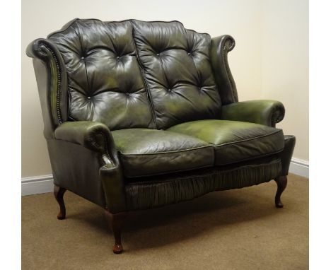 Georgian style two seat sofa upholstered in studded green leather, on cabriole legs, W142cm, H115cm, D90cm Condition Report C