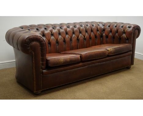 Three seat Chesterfield sofa upholstered deep buttoned brown leather, bun feet, W210cm Condition Report Click here for furthe