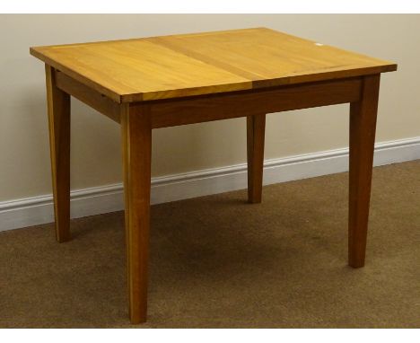 Light oak rectangular extending dining table, with folding leaf, on square tapered supports, L146cm, W86cm, H77cm Condition R