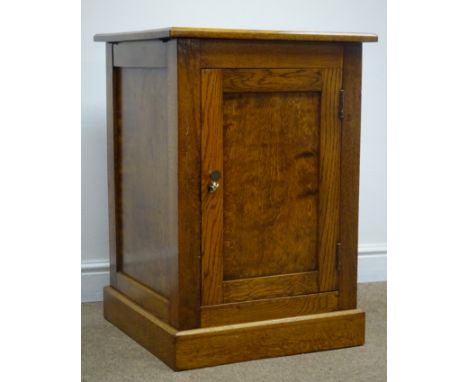 Oak bedside/lamp cupboard, single panelled door, plinth base, W54cm, H77cm, D53cm Condition Report Click here for further ima