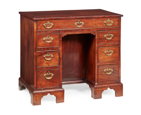 GEORGE III MAHOGANY KNEEHOLE DRESSING TABLE MID 18TH CENTURY the crossbanded top with a moulded edge above a long drawer and 