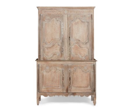 FRENCH PROVINCIAL LIMED OAK ARMOIRE A DEUX CORPS 18TH CENTURY the moulded cornice above a pair of moulded panel doors opening