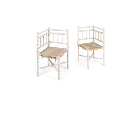 PAIR OF VICTORIAN BOBBIN-TURNED CORNER CHAIRS 19TH CENTURY painted white, with rush seats and bobbin-turned backs and legs, l