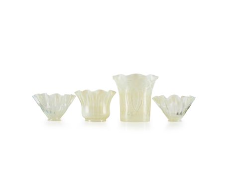 FOUR VASELINE GLASS LAMP SHADES LATE 19TH/ EARLY 20TH CENTURY the first of cylindrical form with a waved rim, with stylised d